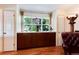 Bright living space featuring a large window, built-in cabinets and classic design at 5215 S Washington St, Littleton, CO 80121