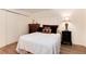 Comfortable bedroom showcases plush pillows, stylish lamps, chest of drawers, and window to exterior at 5215 S Washington St, Littleton, CO 80121