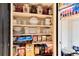 Well-stocked pantry showcasing ample storage space and organization for kitchen essentials at 5215 S Washington St, Littleton, CO 80121