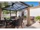 Outdoor patio with seating area, chandelier, and garden views at 5215 S Washington St, Littleton, CO 80121