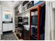 Large walk-in closet with built-in shelves and storage solutions next to the bathroom sink at 1270 N Marion St # 505, Denver, CO 80218