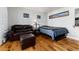 Inviting living room featuring hardwood floors, a comfortable sofa, and a window with natural light at 1270 N Marion St # 505, Denver, CO 80218