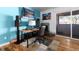 Bright living room with hardwood floors, a fireplace, and a sliding glass door to the balcony at 1270 N Marion St # 505, Denver, CO 80218