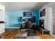 Stylish living room featuring hardwood floors, a fireplace, and a TV mounted on the wall at 1270 N Marion St # 505, Denver, CO 80218