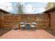 Charming backyard with brick-paved patio and privacy fence, ideal for outdoor relaxation at 3700 Zenobia St, Denver, CO 80212