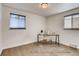 Bright bedroom features hardwood floors, neutral paint and abundant natural light from dual windows at 3700 Zenobia St, Denver, CO 80212
