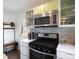 Well-equipped kitchen with stainless steel appliances, modern cabinets, and ample counter space at 3700 Zenobia St, Denver, CO 80212