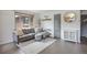 Bright living room with a comfortable gray couch and modern decor accents at 3700 Zenobia St, Denver, CO 80212
