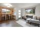 Stylish living room featuring a cozy gray sectional and hardwood floors at 3700 Zenobia St, Denver, CO 80212