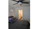A comfortable bedroom features a ceiling fan and ensuite bathroom at 18006 E 103 Ave, Commerce City, CO 80022
