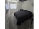 The bedroom has gray carpet and walls, and a window providing natural light at 18006 E 103 Ave, Commerce City, CO 80022