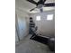 Bright exercise room with workout equipment and a mirrored wall at 18006 E 103 Ave, Commerce City, CO 80022