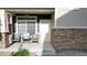 Inviting front porch featuring chairs, perfect for relaxing outdoors with a view at 18006 E 103 Ave, Commerce City, CO 80022