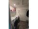 Efficient laundry room featuring modern washer and dryer at 18006 E 103 Ave, Commerce City, CO 80022