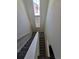 Stairwell showing lots of natural light with carpeted steps and white walls at 18006 E 103 Ave, Commerce City, CO 80022