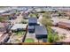 Aerial view of fenced backyard, detached garage, patio and trampoline at 5470 Krameria St, Commerce City, CO 80022