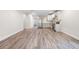 Spacious basement features wood floors, a kitchen, and neutral walls at 5470 Krameria St, Commerce City, CO 80022