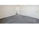 Bedroom with neutral paint, plush carpeting, and closet with large sliding doors at 5470 Krameria St, Commerce City, CO 80022