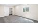 Bright bedroom features neutral walls, carpet, and a closet at 5470 Krameria St, Commerce City, CO 80022