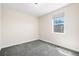 Bedroom featuring modern window with views, neutral paint and plush carpeting at 5470 Krameria St, Commerce City, CO 80022
