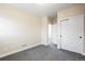 Bedroom with neutral paint, plush carpeting, and closet with large sliding doors at 5470 Krameria St, Commerce City, CO 80022
