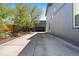 Long concrete driveway leading to an open garage, providing ample parking space and convenience at 5470 Krameria St, Commerce City, CO 80022