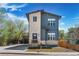 Charming two-story home with gray siding and stone accents, offering a warm and inviting curb appeal at 5470 Krameria St, Commerce City, CO 80022