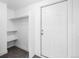 Hallway with closet shelving and access to the outside at 5470 Krameria St, Commerce City, CO 80022