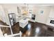 Open kitchen with a center island, stainless steel appliances, and elegant cabinetry, perfect for modern living at 5470 Krameria St, Commerce City, CO 80022