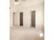 A carpeted bedroom features two closets, one that is a walk-in, creating ample storage options at 905 S Zeno Way # 204, Aurora, CO 80017