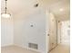 Hallway with neutral walls leading to several rooms, showcasing the house's layout at 905 S Zeno Way # 204, Aurora, CO 80017
