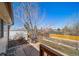 Backyard featuring a grill, patio furniture, garden beds, and well-maintained landscaping at 9231 W Louisiana Ave, Lakewood, CO 80232
