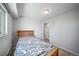 The bedroom has a Broncos-themed bed at 9231 W Louisiana Ave, Lakewood, CO 80232
