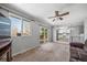 Cozy living room with carpet flooring, natural light, and a ceiling fan at 9231 W Louisiana Ave, Lakewood, CO 80232