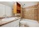 This bathroom features a shower and tub combination and updated cabinets at 7720 W 87Th Dr # J, Arvada, CO 80005