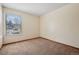 This bedroom features neutral walls and carpet flooring at 7720 W 87Th Dr # J, Arvada, CO 80005