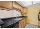 This kitchen features an undermount sink, updated cabinets, and lots of countertop space at 7720 W 87Th Dr # J, Arvada, CO 80005