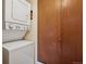 This laundry room offers a stackable washer and dryer at 7720 W 87Th Dr # J, Arvada, CO 80005