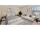 This bedroom features an attached seating area and neutral paint tones at 7720 W 87Th Dr # J, Arvada, CO 80005