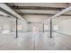 Unfinished basement with sealed concrete floor, support beams, and multiple windows at 268 Simmental Loop, Castle Rock, CO 80104