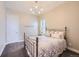 Cozy bedroom featuring carpet floors, light colored walls, and a decorative light fixture at 268 Simmental Loop, Castle Rock, CO 80104