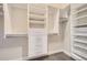 Walk-in closet featuring built-in shelving, drawers, and metal racks for organized storage at 268 Simmental Loop, Castle Rock, CO 80104
