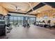 Community gym featuring modern exercise equipment, ceiling fans and panoramic garage door at 268 Simmental Loop, Castle Rock, CO 80104