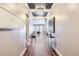 Elegant hallway with hardwood floors, chandelier lighting, neutral paint, and tasteful decor at 268 Simmental Loop, Castle Rock, CO 80104