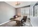 Comfortable home office featuring a wooden desk, stylish leather chair, and plenty of natural light at 268 Simmental Loop, Castle Rock, CO 80104