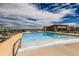 Resort-style pool with lounge chairs, umbrellas, and a clubhouse for ultimate relaxation at 268 Simmental Loop, Castle Rock, CO 80104