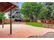 Large flagstone patio and landscaped backyard with privacy fence and mature trees at 6338 S Oneida Ct, Centennial, CO 80111