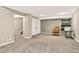 Finished basement area with stairs, dual closets, and space for a living room setup at 6338 S Oneida Ct, Centennial, CO 80111
