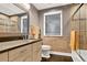Beautiful bathroom with wood floors, modern cabinets, and a framed mirror with designer tile surround at 6338 S Oneida Ct, Centennial, CO 80111