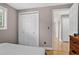 This bedroom features a closet with white doors and hardwood flooring at 6338 S Oneida Ct, Centennial, CO 80111